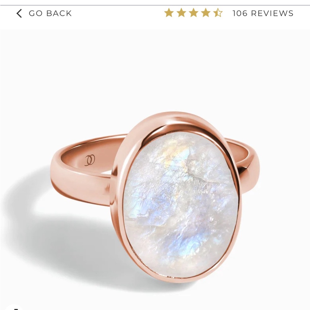 Rose gold and raw crystal moonstone ring. Stone appears more pink in person.